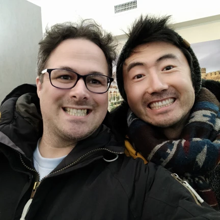 A picture of xuedi and yimu, smiling into the camera in 2015
